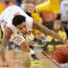 Florida senior Mike Rosario attempts to keep the ball from rolling out of bounds during the first half against Michigan at Cowboys Stadium on Sunday, March 31, 2013. Melanie Maxwell I AnnArbor.com